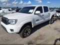 2014 Toyota Tacoma — photo 2 of 17 | VIN 5TFJU4GN5EX061859