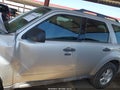 2009 Ford Escape — photo 14 of 16 | VIN 1FMCU93G59KA88233