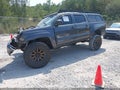 2015 Toyota Tacoma — photo 2 of 15 | VIN 3TMLU4EN6FM192270