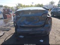 2023 Tesla Model Y — photo 6 of 15 | VIN 7SAYGDEE8PF839158