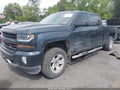 2018 Chevrolet Silverado 1500 — photo 2 of 16 | VIN 3GCUKREC8JG504568