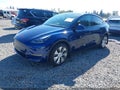 2023 Tesla Model Y — photo 2 of 21 | VIN 7SAYGDEEXPF849206