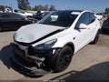 2022 Tesla Model Y — photo 2 of 15 | VIN 7SAYGDEE2NF436077