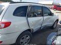 2010 Hyundai Santa Fe — photo 13 of 16 | VIN 5NMSG3AB6AH380291