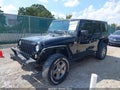 2015 Jeep Wrangler Unlimited — photo 2 of 17 | VIN 1C4BJWDG7FL673858