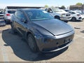 2026 Tesla Model Y — photo 1 of 14 | VIN 7SAYGDEDXTA606610
