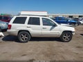 2004 Jeep Grand Cherokee — photo 13 of 16 | VIN 1J8GW58N14C103225