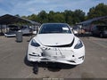 2023 Tesla Model Y — photo 10 of 14 | VIN 7SAYGDEE3PA128030