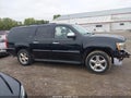 2011 Chevrolet Suburban — photo 14 of 17 | VIN 1GNSKKE30BR201260