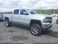 2018 Chevrolet Silverado 1500 — photo 1 of 18 | VIN 3GCUKREC0JG186106