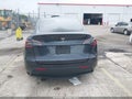 2024 Tesla Model Y — photo 16 of 22 | VIN 7SAYGDED3RA299063