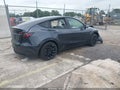 2024 Tesla Model Y — photo 4 of 22 | VIN 7SAYGDED3RA299063