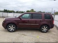 2012 Honda Pilot — photo 11 of 13 | VIN 5FNYF4H91CB024311