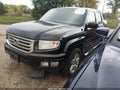 2012 Honda Ridgeline — photo 2 of 17 | VIN 5FPYK1F56CB453252