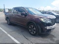 2018 Honda Ridgeline — photo 1 of 16 | VIN 5FPYK2F64JB002011