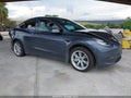 2023 Tesla Model Y — photo 1 of 14 | VIN 7SAYGDEE8PA155482