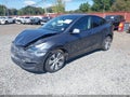 2023 Tesla Model Y — photo 2 of 19 | VIN 7SAYGDEE9PA096345