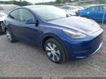 2023 Tesla Model Y — photo 1 of 18 | VIN 7SAYGDEE3PF768869