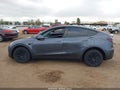 2023 Tesla Model Y — photo 15 of 19 | VIN 7SAYGAEE8PF842592