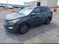 2016 Hyundai Santa Fe — photo 2 of 17 | VIN 5XYZU3LBXGG313085