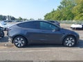 2023 Tesla Model Y — photo 11 of 14 | VIN 7SAYGAEE6PF858676