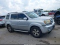 2011 Honda Pilot — photo 13 of 16 | VIN 5FNYF3H70BB016305