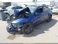 2026 Tesla Model Y — photo 2 of 13 | VIN 7SAYGDED7TF611816