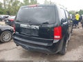 2014 Honda Pilot — photo 4 of 16 | VIN 5FNYF4H57EB009702