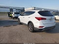2017 Hyundai Santa Fe — photo 3 of 15 | VIN 5XYZU3LBXHG420350
