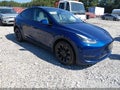 2023 Tesla Model Y — photo 1 of 15 | VIN 7SAYGDEE9PF708420