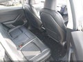 2023 Tesla Model Y — photo 8 of 24 | VIN 7SAYGAEE9PF836834