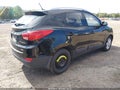 2013 Hyundai Tucson — photo 4 of 12 | VIN KM8JUCACXDU566468