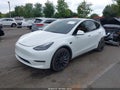 2023 Tesla Model Y — photo 2 of 15 | VIN 7SAYGDEF6PF663669