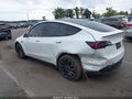 2023 Tesla Model Y — photo 3 of 15 | VIN 7SAYGDEF6PF663669