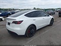 2023 Tesla Model Y — photo 4 of 15 | VIN 7SAYGDEF6PF663669