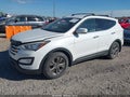 2014 Hyundai Santa Fe — photo 2 of 13 | VIN 5XYZUDLB1EG141788