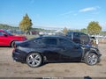 2021 Acura TLX — photo 14 of 17 | VIN 19UUB6F65MA003939