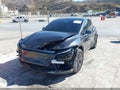 2026 Tesla Model Y — photo 2 of 23 | VIN 7SAYGDED7TF525762