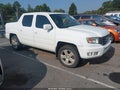 2013 Honda Ridgeline — photo 12 of 16 | VIN 5FPYK1F56DB012576