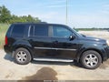 2011 Honda Pilot — photo 13 of 16 | VIN 5FNYF3H93BB052104
