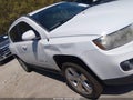 2014 Jeep Compass — photo 13 of 16 | VIN 1C4NJCEBXED660271