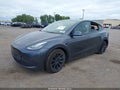 2022 Tesla Model Y — photo 2 of 15 | VIN 7SAYGDEE0NF390409