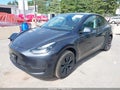 2025 Tesla Model Y — photo 2 of 20 | VIN 7SAYGDED0SA374839
