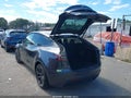2025 Tesla Model Y — photo 3 of 20 | VIN 7SAYGDED0SA374839