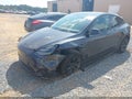 2024 Tesla Model Y — photo 2 of 15 | VIN 7SAYGDED3RA324933