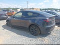 2024 Tesla Model Y — photo 3 of 15 | VIN 7SAYGDED3RA324933