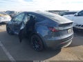 2023 Tesla Model Y — photo 3 of 18 | VIN 7SAYGDEF0PF864838