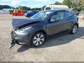 2024 Tesla Model Y — photo 2 of 20 | VIN 7SAYGDEE2RF032122