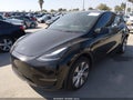 2024 Tesla Model Y — photo 2 of 19 | VIN 7SAYGDEEXRA237278