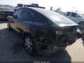 2024 Tesla Model Y — photo 3 of 19 | VIN 7SAYGDEEXRA237278